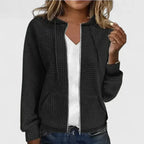 Olivia™ elegant cardigan by Les Odettes, featuring a soft knit fabric and classic design, displayed on a neutral background.