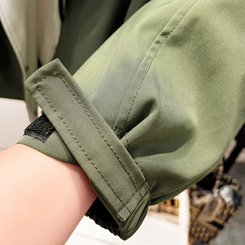 Aurelia™ windbreaker jacket by Les Odettes, shown in lightweight fabric with a zipper front and adjustable hood for outdoor wear.