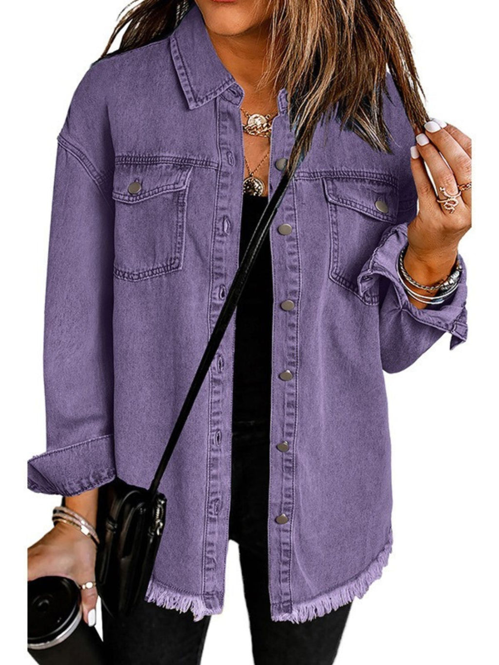 Les Odettes Madeline™ Classic Everyday Denim Jacket hanging on a hanger with visible stitching and button details.
