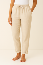 Women’s linen blend trousers by Les Odettes, regular fit, breathable fabric, shown in a natural pose with a focus on the trousers.