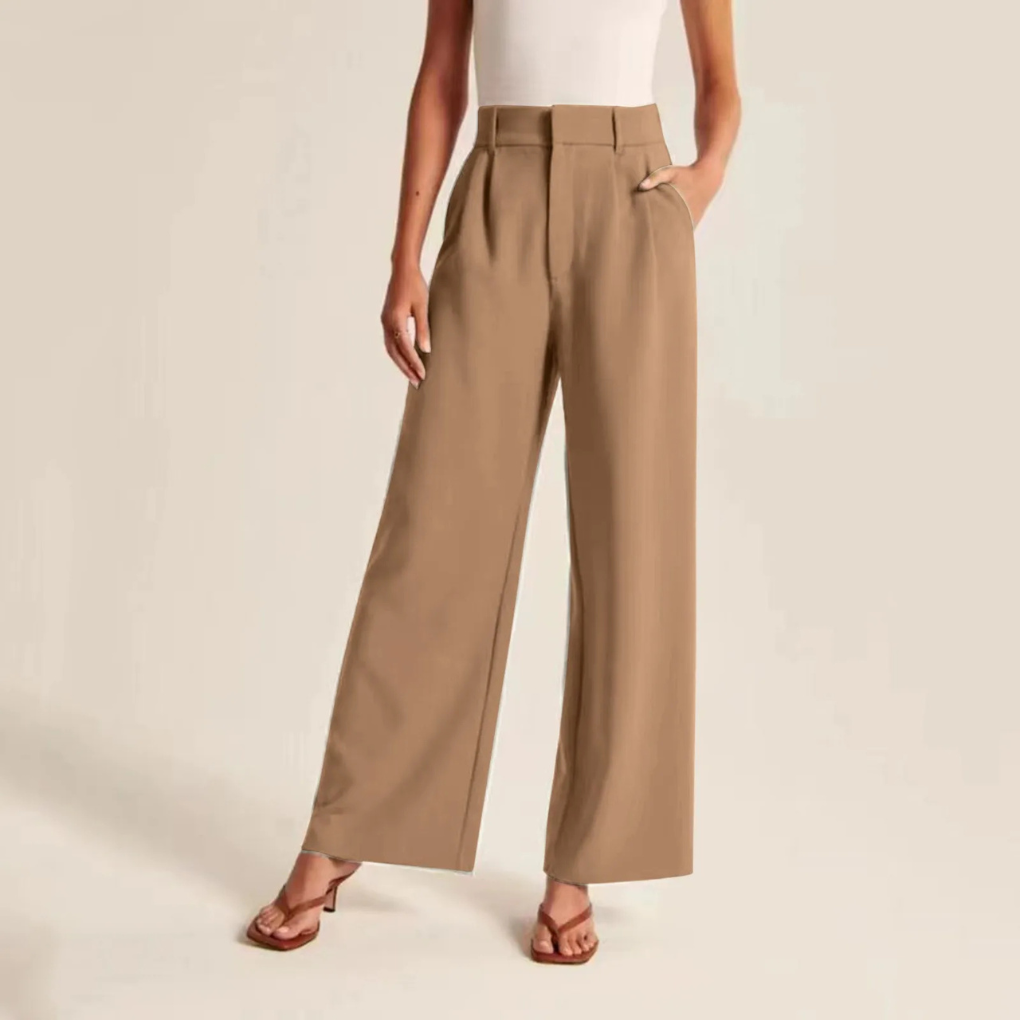Women’s pleated high waist wide-leg trousers by Les Odettes in linen feel fabric, shown from the side on a neutral background.