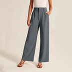 Women’s pleated high waist trousers with wide legs in linen-like fabric from Les Odettes, shown in a neutral color.