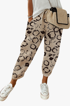 Women’s printed loose fit trousers with elastic waistband by Les Odettes, featuring colorful floral pattern and relaxed style.
