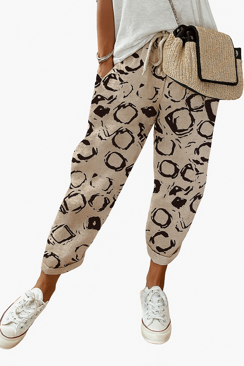 Women’s printed loose fit trousers with elastic waistband by Les Odettes, featuring colorful floral pattern and relaxed style.