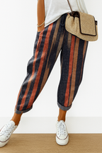 Women’s printed loose fit trousers with elastic waistband by Les Odettes, featuring vibrant floral pattern and relaxed style.