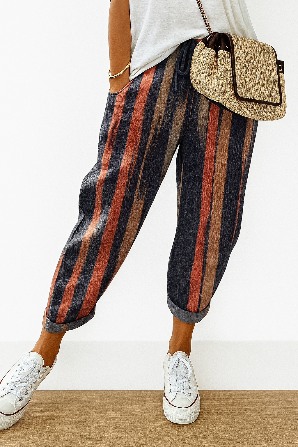 Women’s printed loose fit trousers with elastic waistband by Les Odettes, featuring vibrant floral pattern and relaxed style.