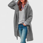 Les Odettes Margie™ Sleek City Jacket displayed on a model, featuring a modern, fitted design in a neutral color.