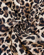 Aleah™ reversible coat from Les Odettes featuring a stylish leopard print, shown with both sides visible in the image.