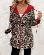 Aleah™ reversible coat by Les Odettes featuring a stylish leopard print on one side and solid fabric on the other.