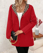 Aleah™ reversible coat by Les Odettes featuring a stylish leopard print, shown folded open with one side displaying the animal pattern.