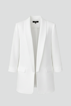 Les Odettes Elysia women's fitted wrap collar blazer displayed on a hanger, featuring tailored design and classic styling.