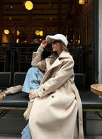 Ramona™ Elegant Coat by Les Odettes, stylish tailored wool coat with a classic collar and button closure, shown in a fashion photo.