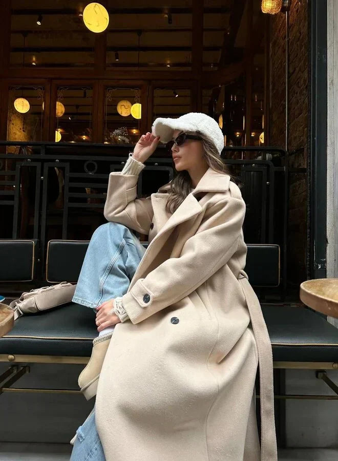 Ramona™ Elegant Coat by Les Odettes, stylish tailored wool coat with a classic collar and button closure, shown in a fashion photo.