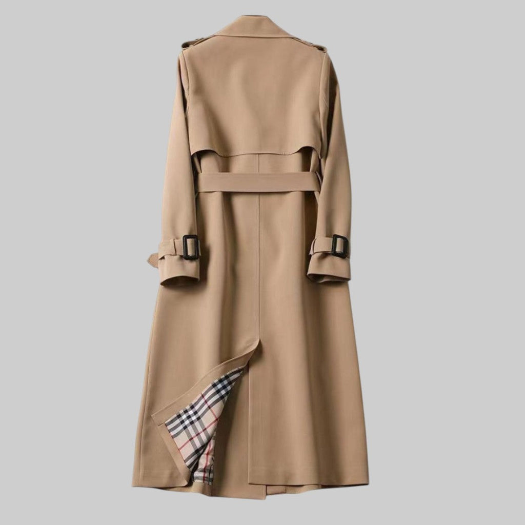 Les Odettes Aleah™ classic trench coat in beige, shown on a model with a tailored fit and traditional double-breasted design.