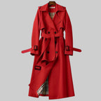 Les Odettes Aleah™ Classic Trench Coat displayed on a model, showcasing the tailored fit and beige fabric against a city background.