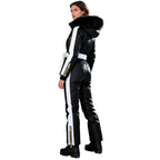 Les Odettes Dolly Glamour Ski Suit Monosuit in black and white with fur-lined hood, back view showcasing belted waist and stylish design.
