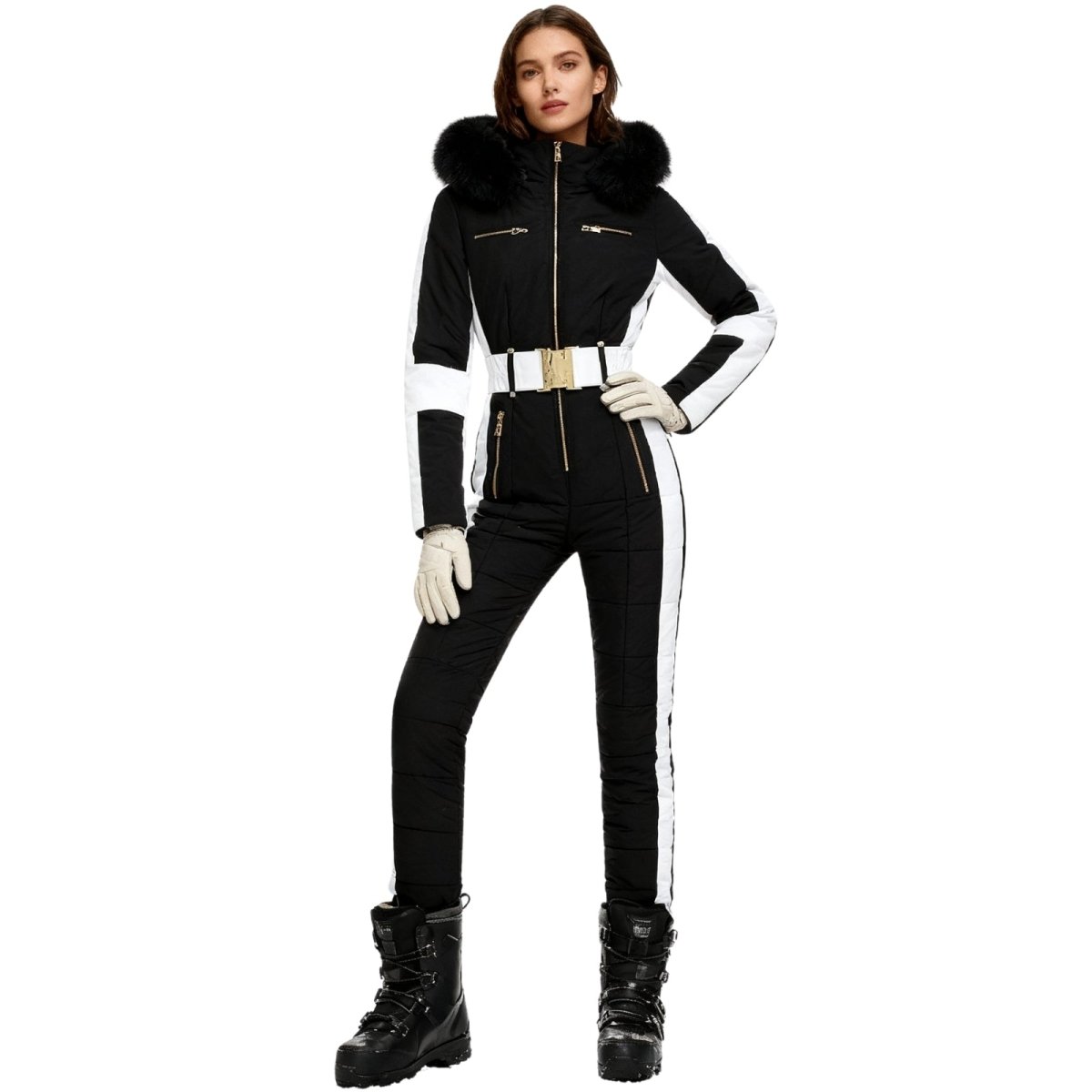 Les Odettes Dolly glamour ski suit monosuit with belted waist, black and white fur-lined hood, perfect for winter snowboarding.