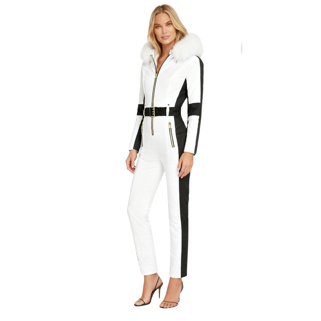 Les Odettes Dolly women's ski suit with white fur hood, side view, stylish one-piece snow outerwear for winter skiing.