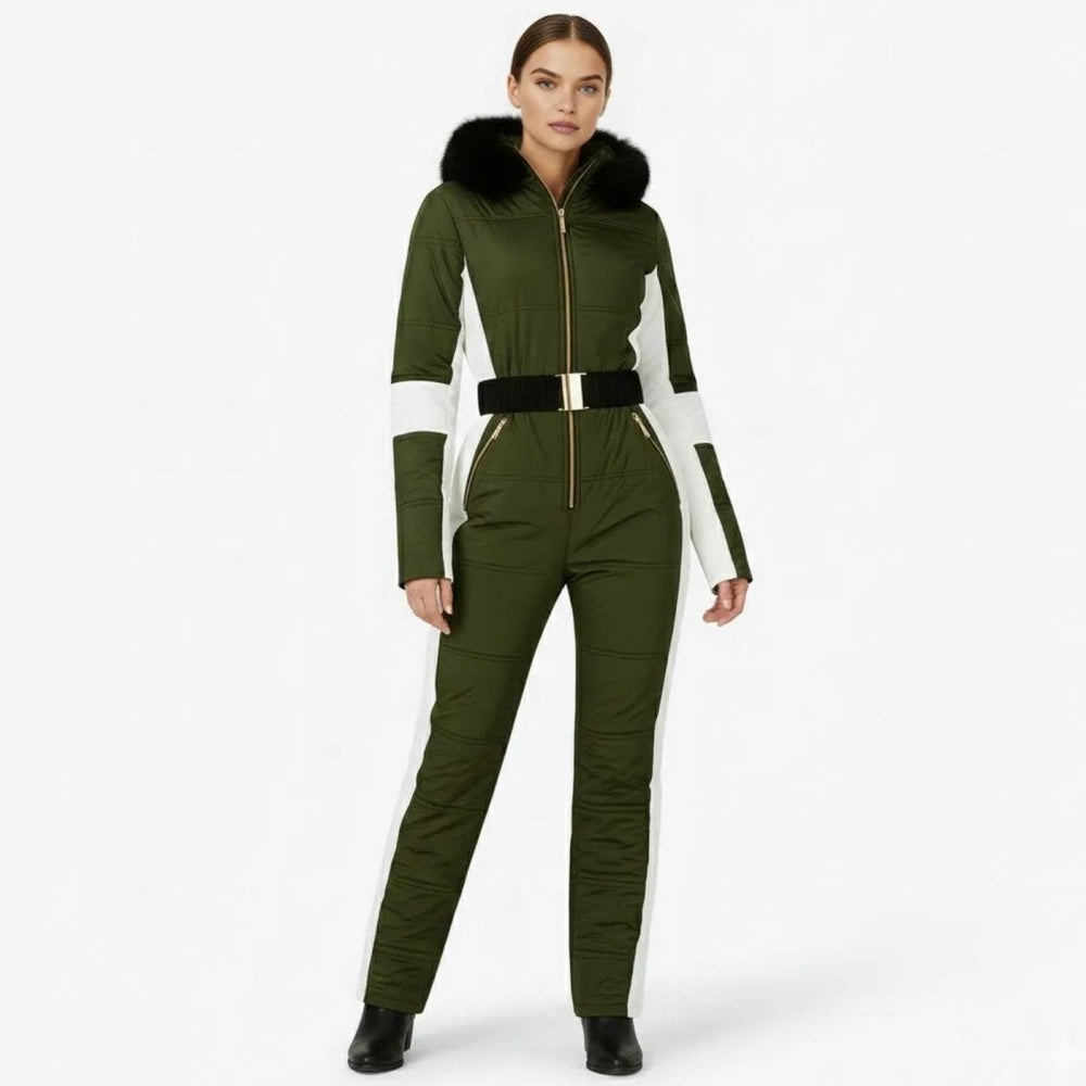 Green women's one-piece ski suit by Les Odettes, waterproof snow outfit with belt, front view showcasing stretch winter outerwear.