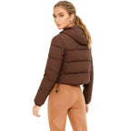 Les Odettes women's brown cropped puffer jacket with lightweight insulation, nylon exterior, shown from the back.
