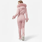 Back view of Les Odettes women's pink quilted ski suit, showcasing the stylish, insulated design perfect for winter sports.