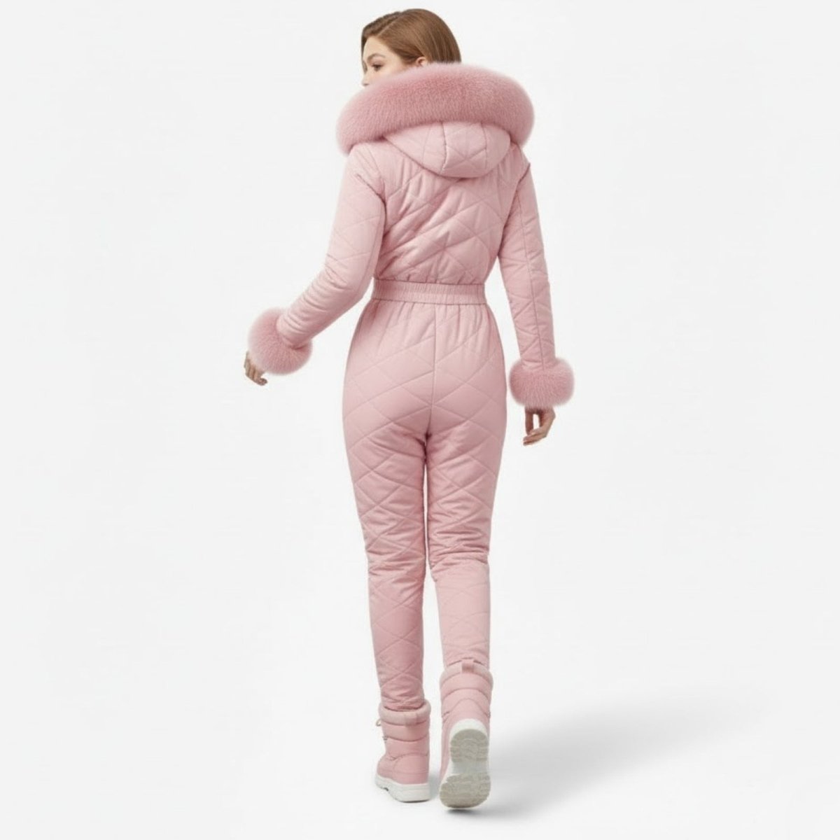 Back view of Les Odettes women's pink quilted ski suit, showcasing the stylish, insulated design perfect for winter sports.