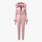 Pink women’s quilted ski suit by Les Odettes, featuring front view with a sleek, padded design perfect for winter sports.
