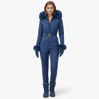 Blue women's ski suit by Les Odettes, front view on model, showcasing a fitted design for winter sports.