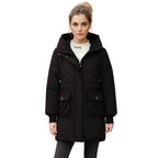 Black women’s hooded puffer jacket by Les Odettes, front view showing quilted insulation and cozy hood.