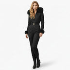Black women's quilted ski suit by Les Odettes, front view showing insulated winter outerwear for cold weather skiing.