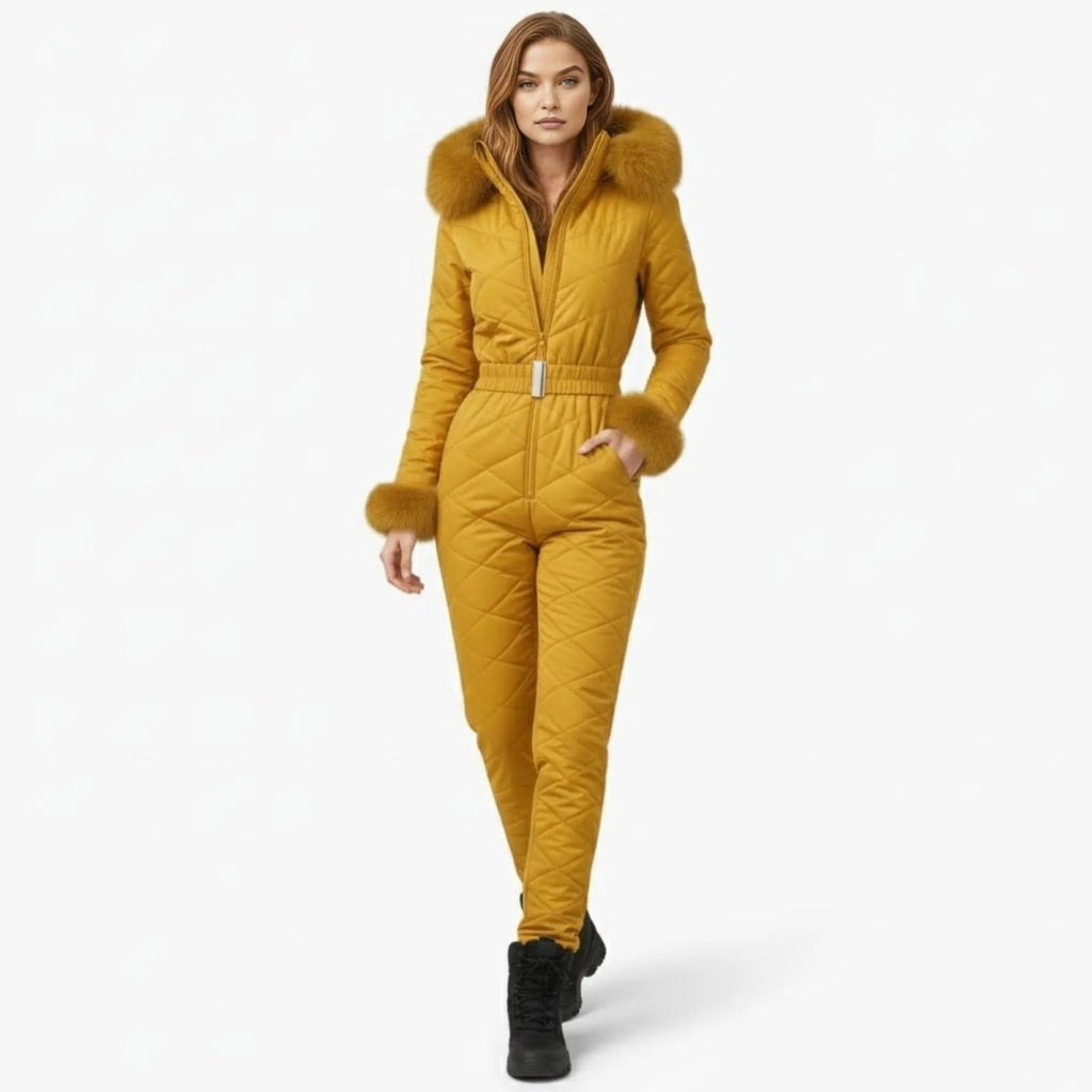 Yellow quilted women's ski suit by Les Odettes, front view showing insulated, stylish ski jumpsuit with a fitted design.