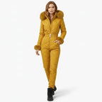Yellow quilted women's ski suit by Les Odettes, front view showing insulated, stylish ski jumpsuit with a fitted design.
