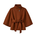 Brown women's sculptural cape jacket by Les Odettes, featuring a belt and wool blend outerwear design, front view.