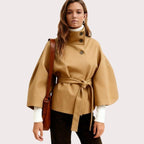 Women’s Khaki Sculptural Cape Jacket by Les Odettes, cotton twill outerwear with belt, front view showing stylish design.