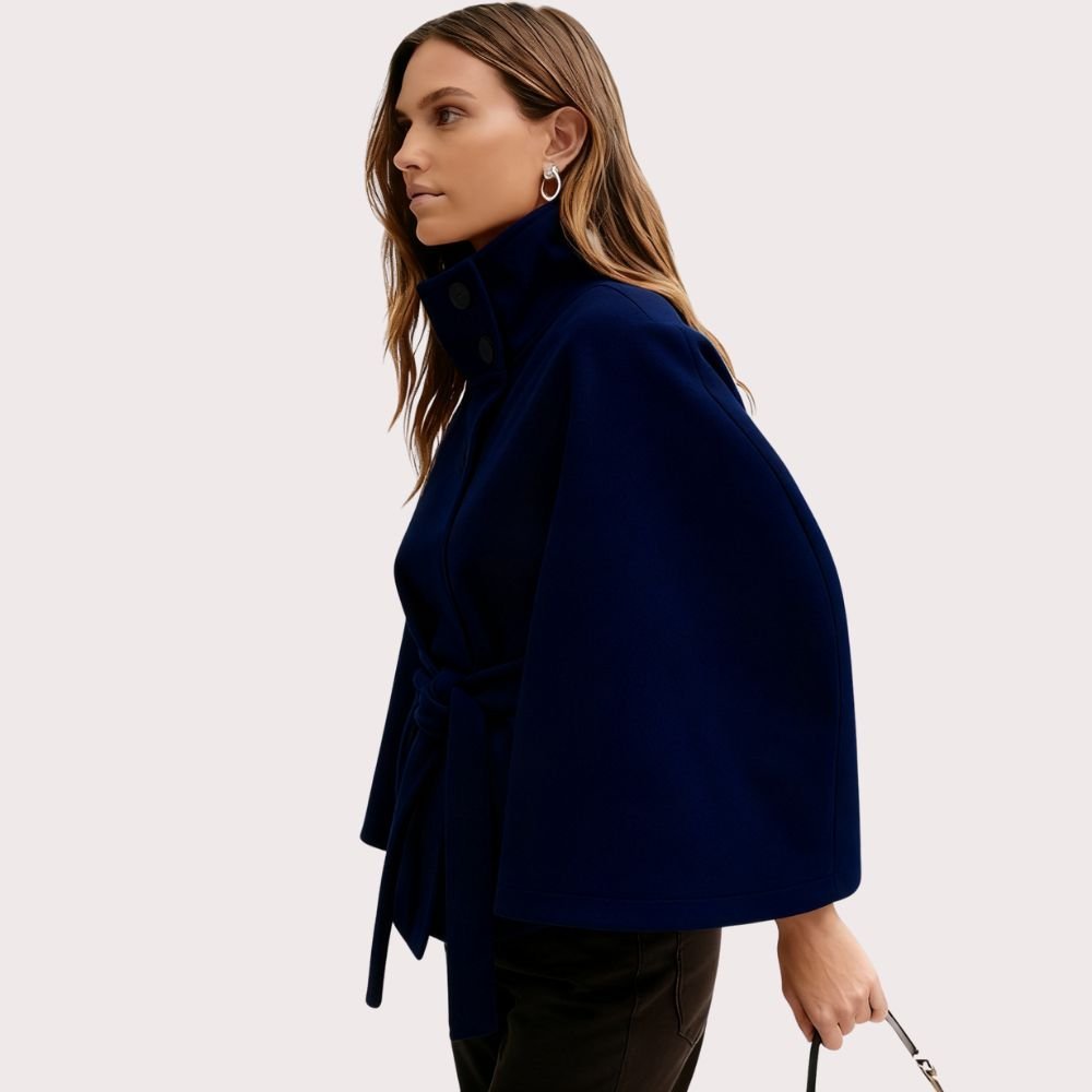 Navy blue women's wool blend sculptural cape jacket with belt, front side view, by Les Odettes, stylish outerwear with unique design.