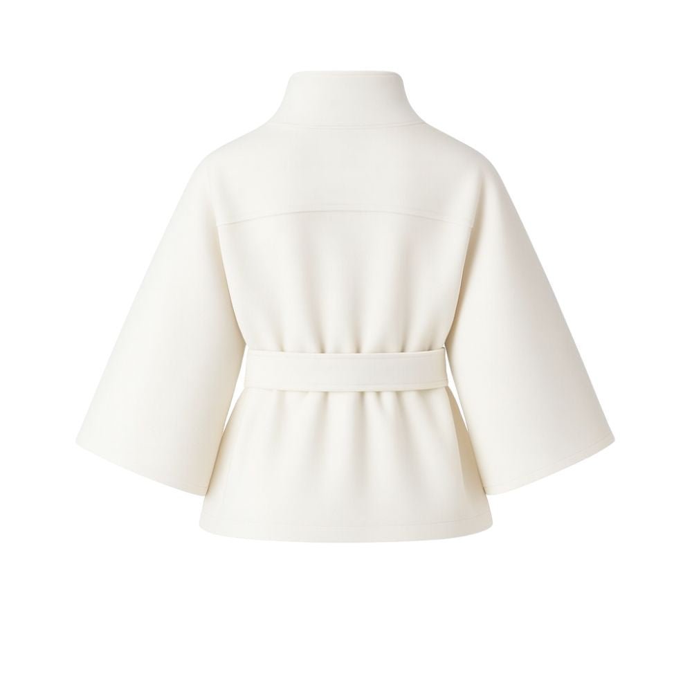 White women's wool blend sculptural cape jacket with belt, featuring a stylish outerwear design and flowing silhouette.