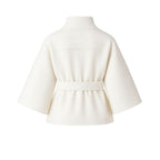 White women's wool blend sculptural cape jacket with belt, featuring a stylish outerwear design and flowing silhouette.