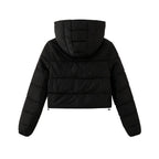 Back view of Les Odettes women's black cropped puffer jacket with lightweight insulation and nylon fabric.