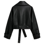 Black women's vegan leather moto jacket by Les Odettes, shown from the back with stylish stitched design and classic moto silhouette.