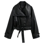 Black women’s vegan leather moto jacket by Les Odettes, featuring a stylish front view with classic moto jacket details.