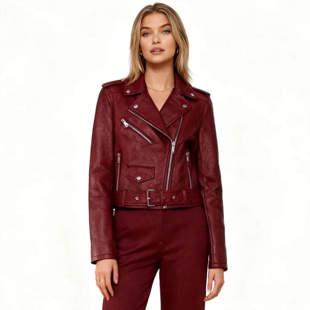 Front view of a woman wearing Les Odettes burgundy vegan leather moto jacket with classic collar and zip details.