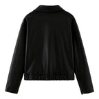 Back view of Les Odettes women's black vegan leather cropped bomber jacket, showcasing its sleek design and fitted silhouette.