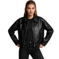 Women’s black vegan leather jacket by Les Odettes, cropped bomber style with a sleek and modern design.