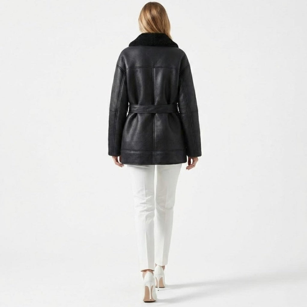 Back view of Les Odettes women's belted faux shearling aviator jacket featuring a cozy, textured shearling exterior and stylish design.