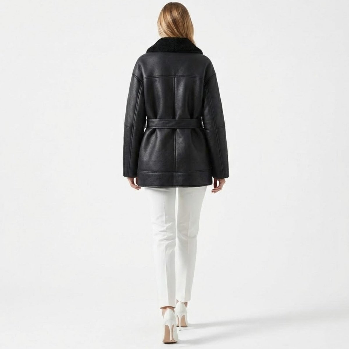 Back view of Les Odettes women's belted faux shearling aviator jacket featuring a cozy, textured shearling exterior and stylish design.