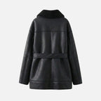 Black women's shearling jacket by Les Odettes, shown flat with back view, featuring cozy shearling trim and stylish design.