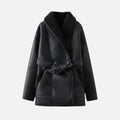 Black women’s shearling jacket from Les Odettes, shown flat with front view, featuring soft shearling lining and stylish collar.