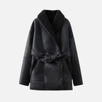 Black women’s shearling jacket from Les Odettes, shown flat with front view, featuring soft shearling lining and stylish collar.