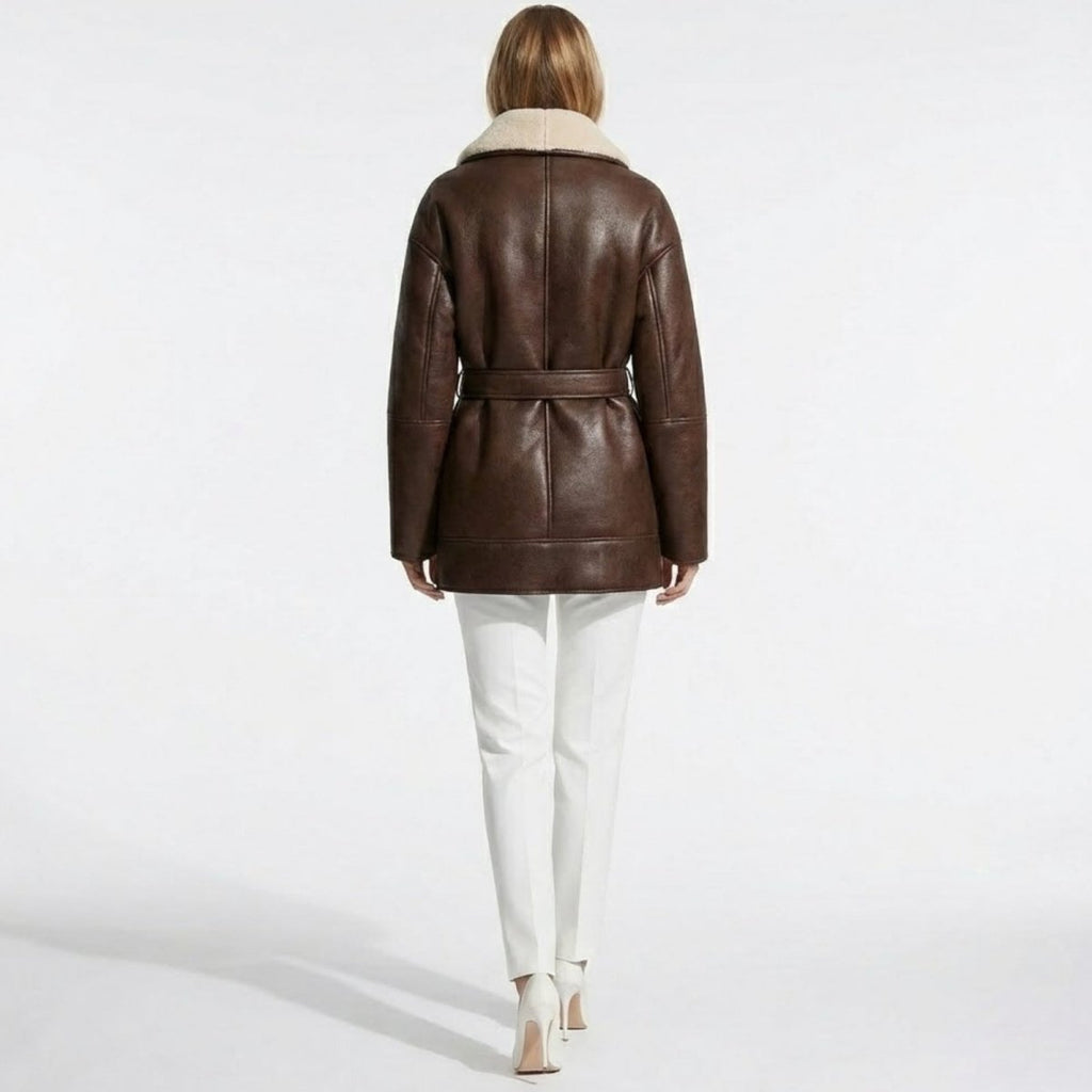 Back view of Les Odettes women's faux shearling jacket, showcasing cozy, textured shearling material and stylish design.