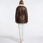 Back view of Les Odettes women's faux shearling jacket, showcasing cozy, textured shearling material and stylish design.